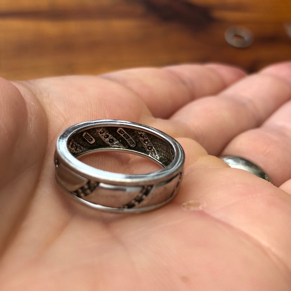 Sterling band w/ CZ setting. Marked China 925 CZ.